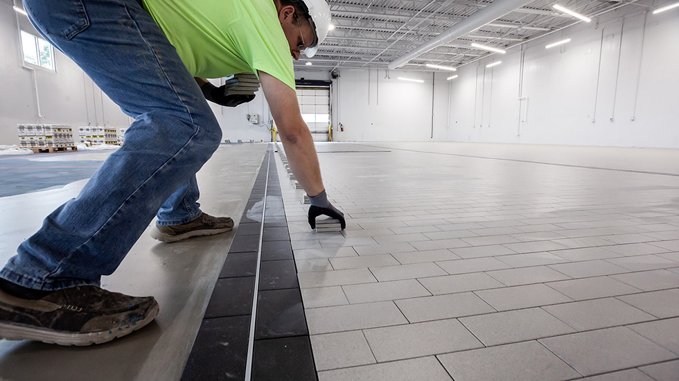 installation of flooring at auto dealership