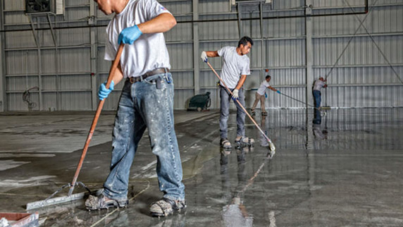 installing commercial epoxy flooring in warehouse